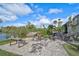 Community patio with fire pit, seating, and picturesque waterfront views at 304 Pine Run Dr, Osprey, FL 34229