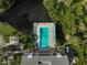 Relaxing community pool with surrounding nature at 304 Pine Run Dr, Osprey, FL 34229