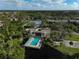 Community pool and clubhouse aerial view at 304 Pine Run Dr, Osprey, FL 34229