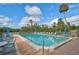 Refreshing community pool area with surrounding lounge chairs at 304 Pine Run Dr, Osprey, FL 34229