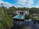 Community pool and clubhouse aerial view at 304 Pine Run Dr, Osprey, FL 34229