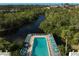 Refreshing community pool with lounge chairs at 304 Pine Run Dr, Osprey, FL 34229