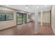 Sunroom showcasing light wood-look floors and sliding glass doors at 304 Pine Run Dr, Osprey, FL 34229