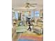 Dining area with glass table and kitchen view at 305 47Th Avenue W Dr # 143, Bradenton, FL 34207