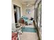 Enclosed patio with seating area and glass windows at 305 47Th Avenue W Dr # 143, Bradenton, FL 34207