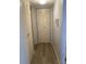 Hallway with two closets and light-colored flooring at 305 47Th Avenue W Dr # 143, Bradenton, FL 34207