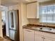 Stainless steel refrigerator in a white kitchen at 305 47Th Avenue W Dr # 143, Bradenton, FL 34207