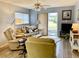Living room with recliner, sofa, and access to patio at 305 47Th Avenue W Dr # 143, Bradenton, FL 34207