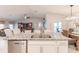 Island kitchen with granite countertops and stainless steel dishwasher at 3164 Lotus Rd, North Port, FL 34291