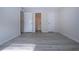 Bright bedroom with wood-look vinyl flooring and access to a full bathroom at 3259 Beneva Rd # 102, Sarasota, FL 34232