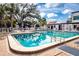 Relaxing community pool with plenty of lounge chairs at 3259 Beneva Rd # 102, Sarasota, FL 34232