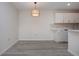 Modern white kitchen with mosaic backsplash and new appliances at 3259 Beneva Rd # 102, Sarasota, FL 34232