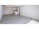 Open living and dining area with updated flooring and a kitchen at 3259 Beneva Rd # 102, Sarasota, FL 34232