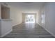 Bright living room with light gray vinyl flooring and sliding glass doors at 3259 Beneva Rd # 102, Sarasota, FL 34232