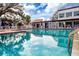 Inviting community pool with ample deck space for lounging at 3259 Beneva Rd # 102, Sarasota, FL 34232
