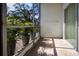 Bright screened patio with tile floor, potted plants, and sliding glass doors at 3259 Beneva Rd # 102, Sarasota, FL 34232