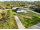 Aerial view of a single-Gathering home with a large lot and driveway at 3782 Horace Ave, North Port, FL 34286