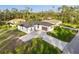 Aerial view of a house with a large driveway at 3782 Horace Ave, North Port, FL 34286