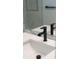 Modern black faucet on a white bathroom sink at 3782 Horace Ave, North Port, FL 34286