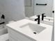 White vanity with black matte faucet and quartz countertop at 3782 Horace Ave, North Port, FL 34286