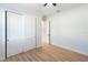 Bedroom with light walls, wood-look floors and white closet doors at 3782 Horace Ave, North Port, FL 34286