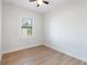 Simple bedroom with light walls and wood-look flooring at 3782 Horace Ave, North Port, FL 34286