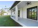 Covered patio with ceiling fan and sliding glass doors at 3782 Horace Ave, North Port, FL 34286