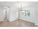 Spacious dining room with hardwood floors and large window at 3782 Horace Ave, North Port, FL 34286