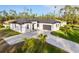 Single-Gathering home with a modern design, paver driveway, and landscaping at 3782 Horace Ave, North Port, FL 34286