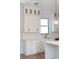 Modern kitchen with white shaker cabinets and quartz countertops at 3782 Horace Ave, North Port, FL 34286