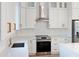 Clean kitchen design with white cabinets, stainless steel appliances, and white subway tile at 3782 Horace Ave, North Port, FL 34286