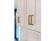 White kitchen cabinets with gold hardware at 3782 Horace Ave, North Port, FL 34286