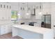 Modern kitchen with white cabinets, stainless steel appliances, and quartz countertops at 3782 Horace Ave, North Port, FL 34286