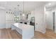 Modern kitchen with large island and stainless steel appliances at 3782 Horace Ave, North Port, FL 34286