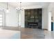 Spacious living room featuring a modern fireplace and hardwood floors at 3782 Horace Ave, North Port, FL 34286
