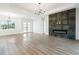 Bright living room with hardwood floors, fireplace, and lots of natural light at 3782 Horace Ave, North Port, FL 34286