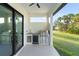 Outdoor kitchen with stainless steel appliances and granite countertop at 3782 Horace Ave, North Port, FL 34286