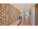 Modern entryway with patterned tile wall and built-in bench at 420 Beach Rd # 407, Sarasota, FL 34242