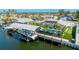 The waterfront shows boat lift access, a pool, putting green, solar panels, and well-kept landscaping at 4204 Royal Palm Dr, Bradenton, FL 34210