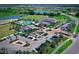 Aerial view of community amenities including pool, clubhouse, and parking at 4326 Silo Port Ct, Lakewood Ranch, FL 34211