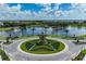 Aerial view of community lake with fountain and star-shaped landscaping at 4326 Silo Port Ct, Lakewood Ranch, FL 34211