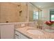 Bathroom with vanity, sink, and walk-in shower at 4326 Silo Port Ct, Lakewood Ranch, FL 34211