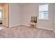 Bright bedroom with carpet flooring, window shutters, and access to another room at 4326 Silo Port Ct, Lakewood Ranch, FL 34211