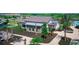 Community clubhouse with stone exterior, landscaping, and bike rack at 4326 Silo Port Ct, Lakewood Ranch, FL 34211