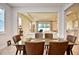 Spacious dining area with glass-top table and leather chairs at 4326 Silo Port Ct, Lakewood Ranch, FL 34211