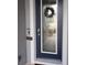 Modern front door with decorative glass and a festive wreath at 4326 Silo Port Ct, Lakewood Ranch, FL 34211
