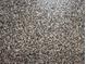 Close-up view of a speckled, grey garage floor at 4326 Silo Port Ct, Lakewood Ranch, FL 34211