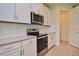 Kitchen with white cabinets, stainless steel appliances, and walk-in pantry at 4326 Silo Port Ct, Lakewood Ranch, FL 34211