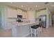 Modern kitchen with white cabinets, granite countertops, and stainless steel appliances at 4326 Silo Port Ct, Lakewood Ranch, FL 34211
