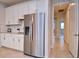 Kitchen features stainless steel refrigerator and white cabinets at 4326 Silo Port Ct, Lakewood Ranch, FL 34211